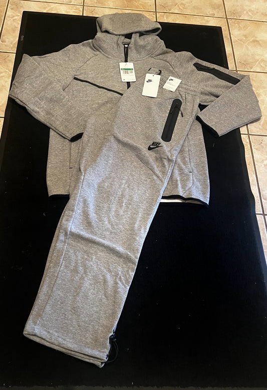 Gray Nike Tech sweatpants and hoodie